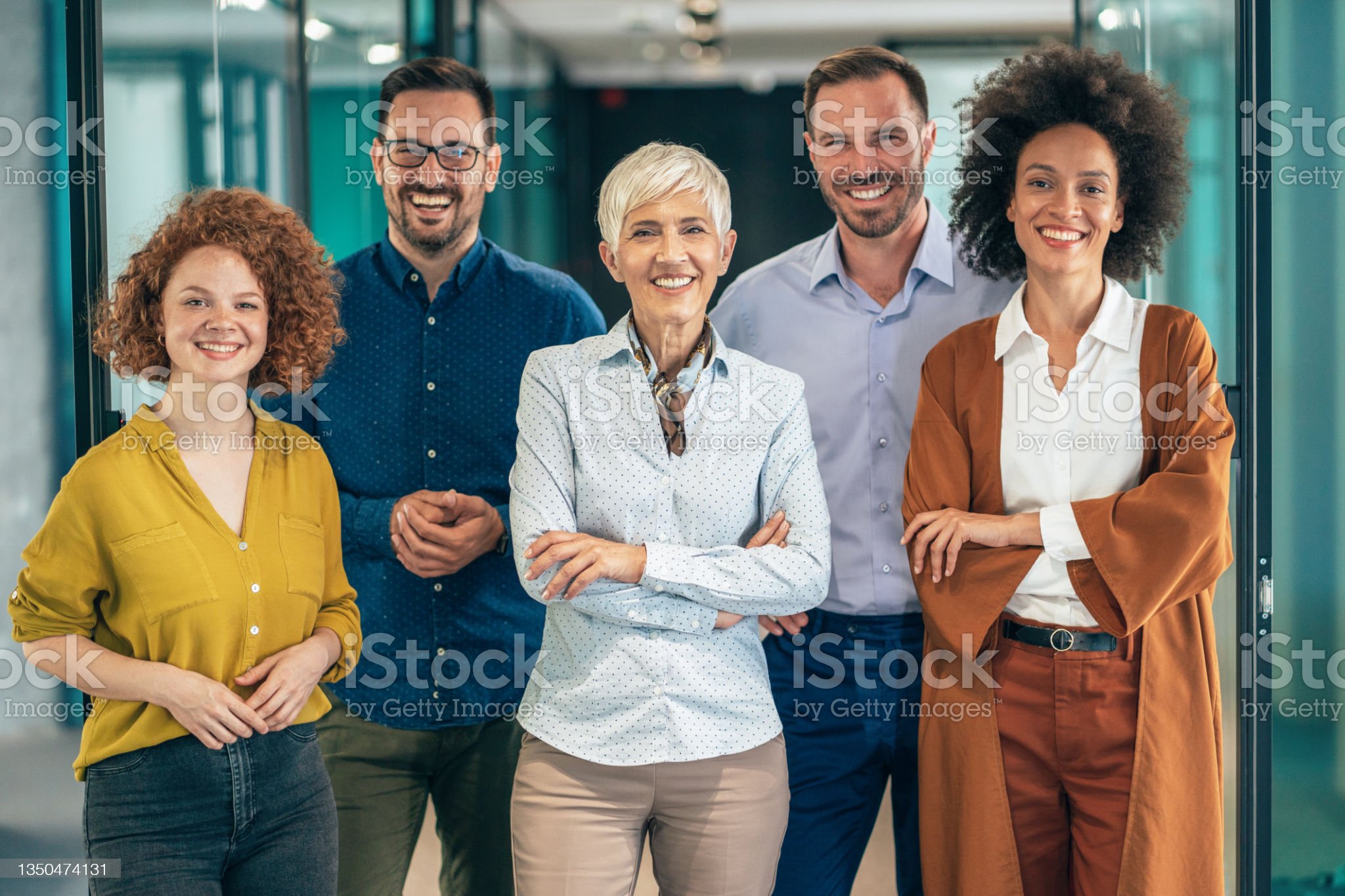 Portrait of Modern multi ethnic business team standing and looking at camera